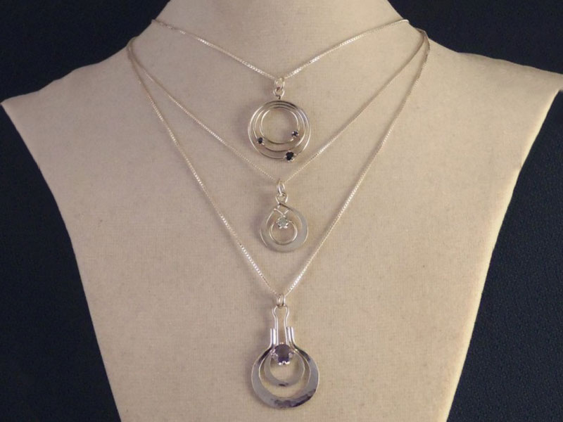 Sapphire Orbits Pendant, Blue Topaz Double Tear Drop Pendant, and Iolite Hammered Pendant